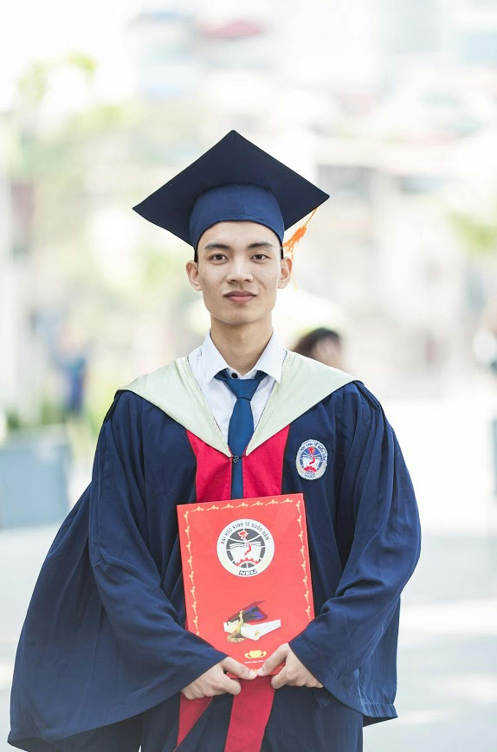 Man In Toga Holding Diploma