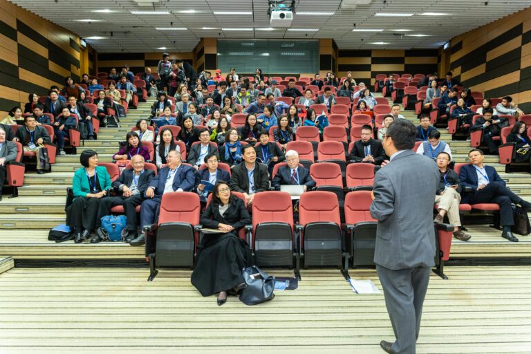 Man Standing In Front Of People